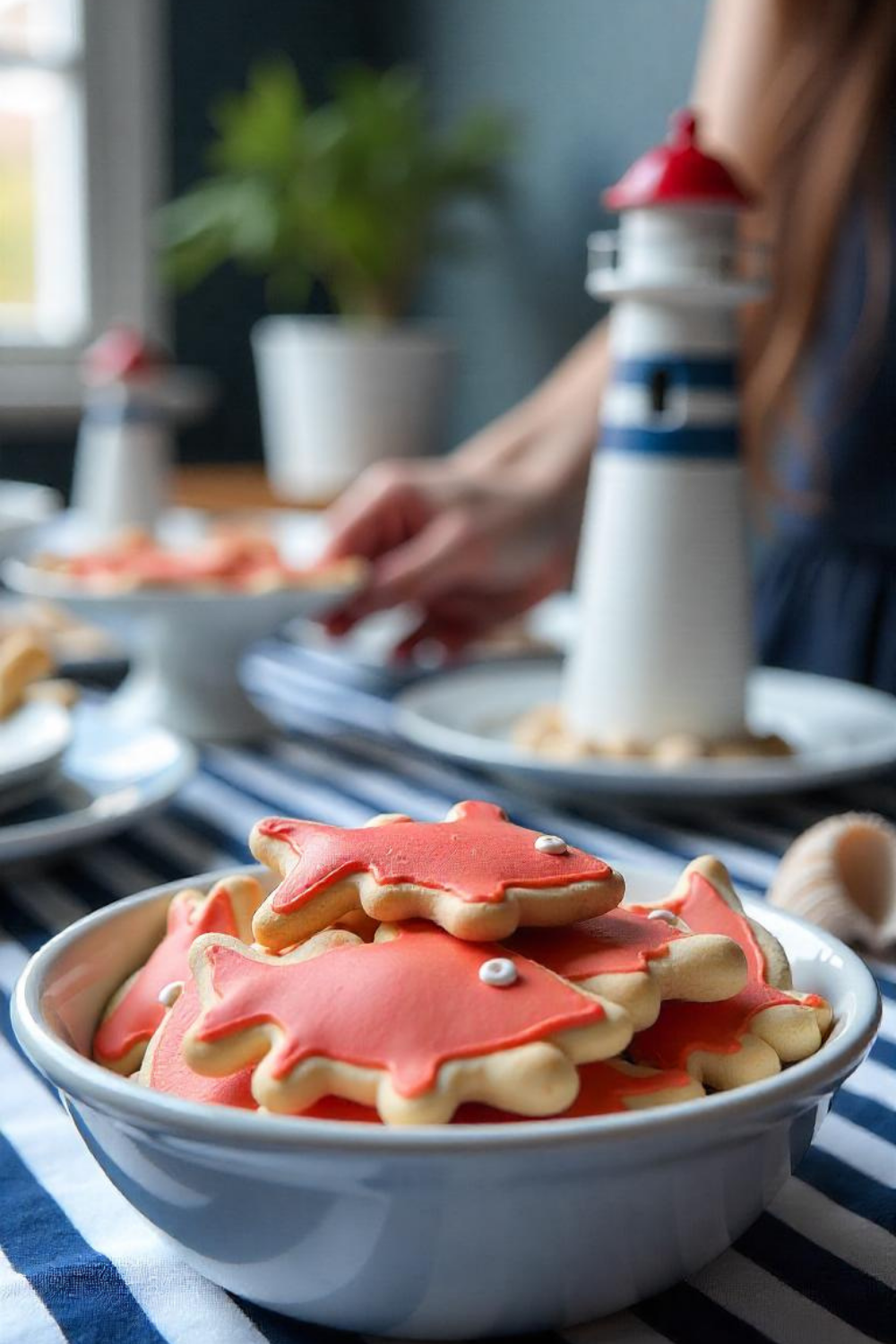 A maritime-themed baby shower with navy blue, red, and white decor, striped patterns, and anchor accents.