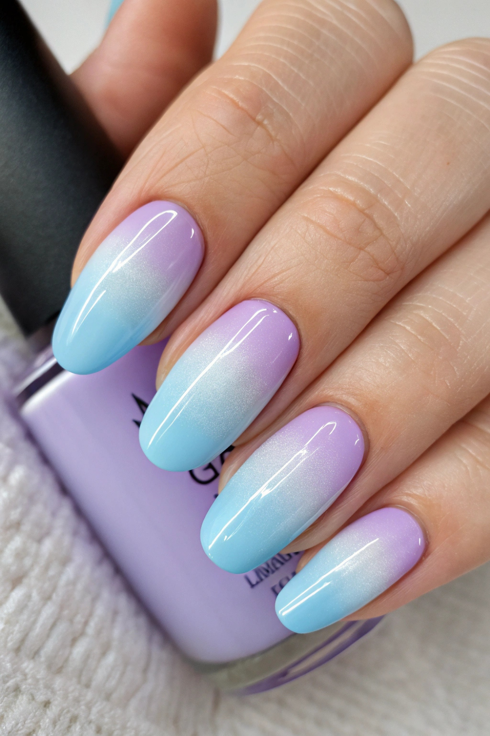Soft lavender fading into baby blue gives your nails an ethereal, magical touch.