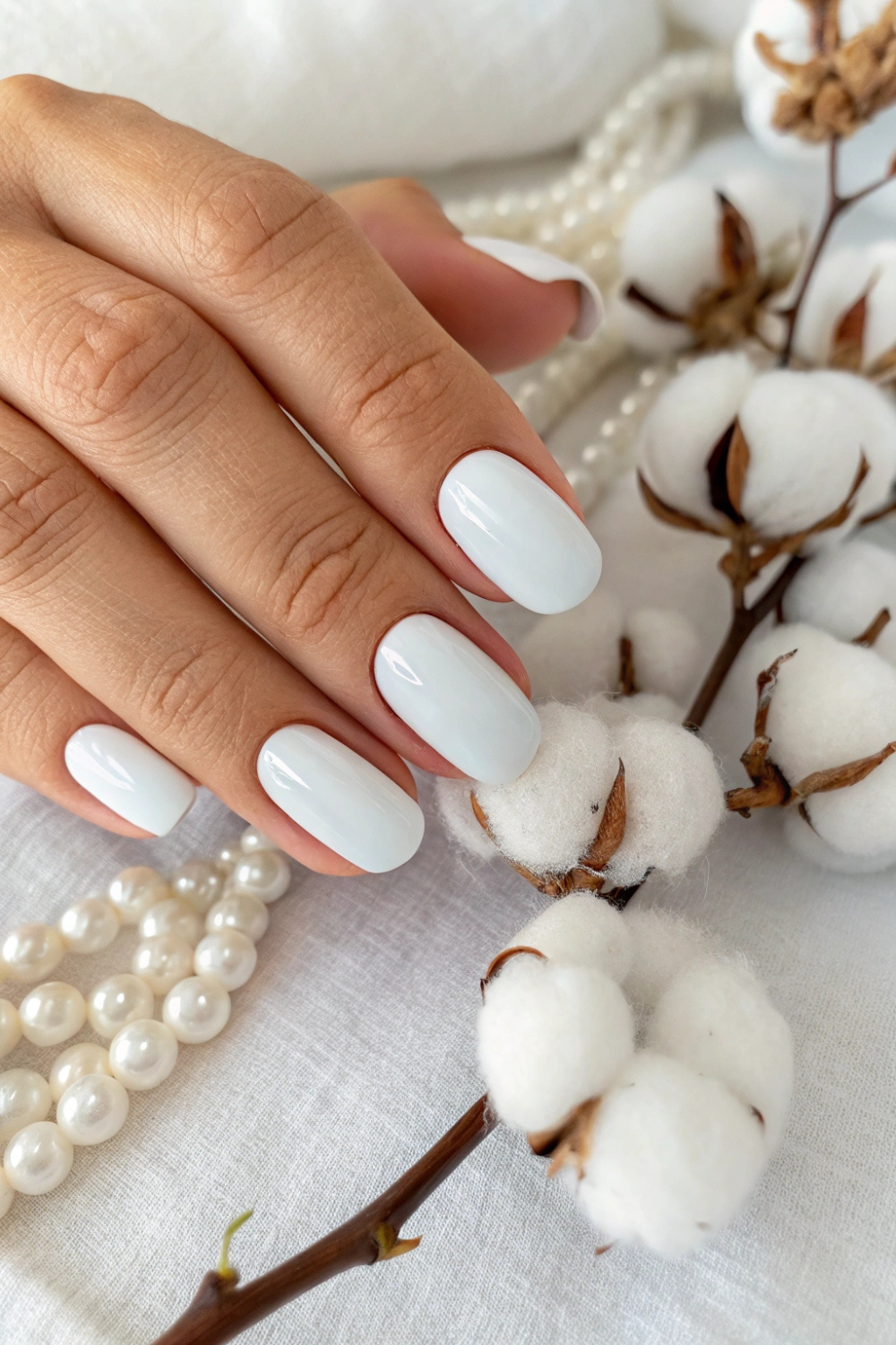 A clean, milky white manicure that gives a soft, airy look—like a summer cloud.